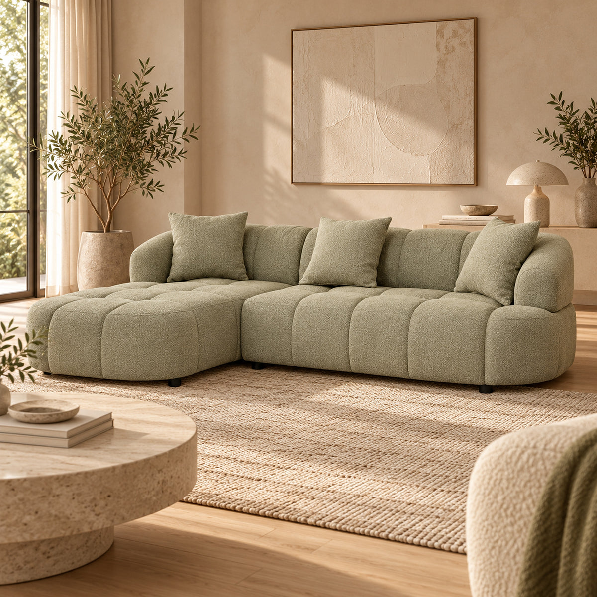 Alberta Pistachio 3 seater chaise lounge with rounded arms, tufted upholstery and three scatter cushions, left-hand chaise view