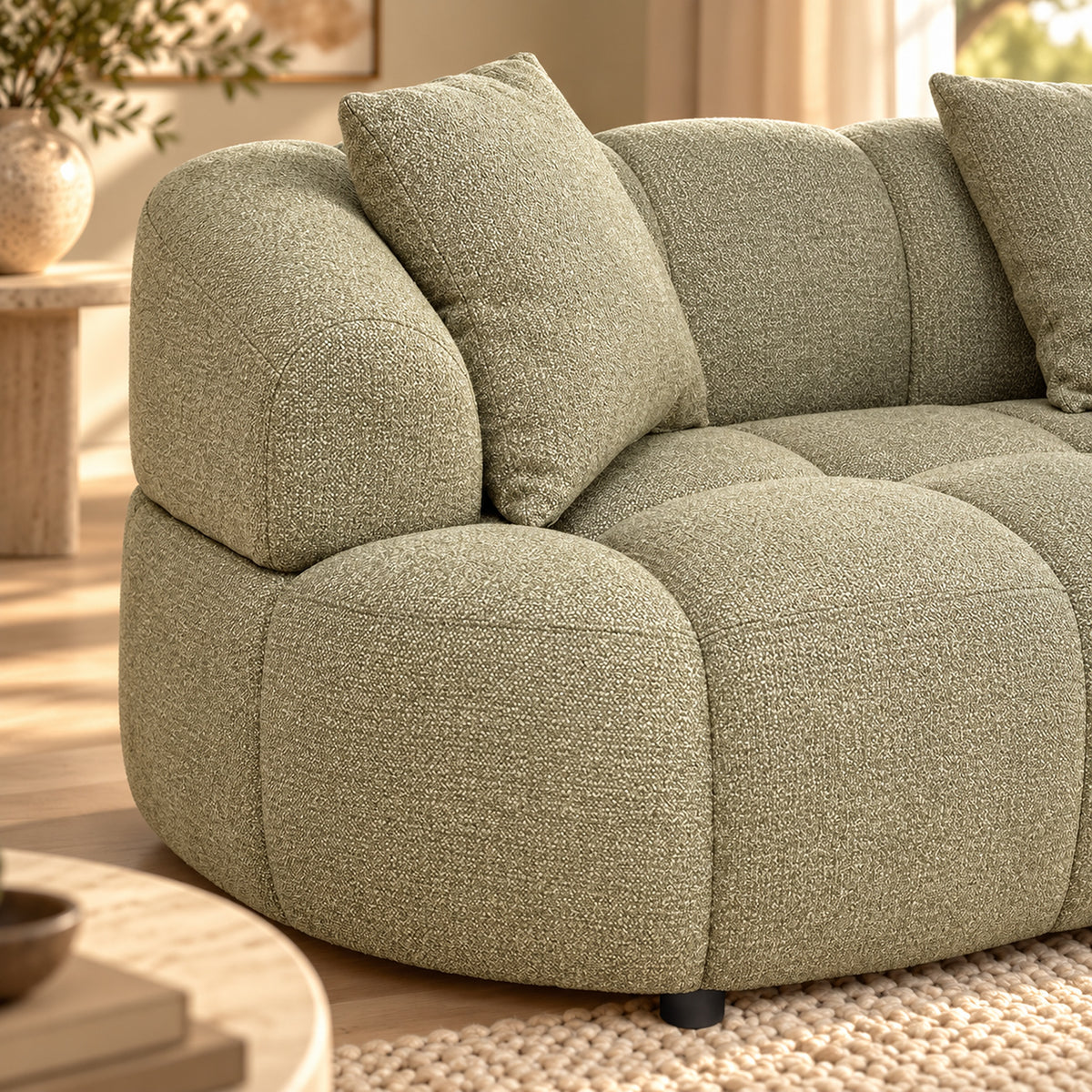 Alberta Pistachio 3 seater chaise lounge with rounded arms, tufted upholstery and three scatter cushions, close up view