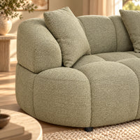 Alberta Pistachio 3 seater chaise lounge with rounded arms, tufted upholstery and three scatter cushions, close up view