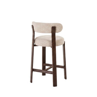 A modern bar stool with a curved, light beige upholstered backrest and seat cushion, supported by a dark brown wooden frame with a footrest, shown against a plain white background.