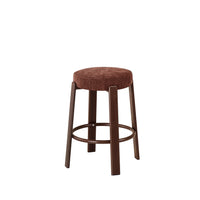 A bar stool with a round brown upholstered seat cushion and a dark brown wooden frame with a footrest ring, shown on a plain white background.
