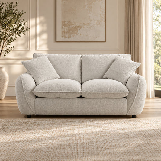 Bradman Snow 2 seater duck feather sofa with curved arms, plush cushions and textured Shay fabric upholstery, front view