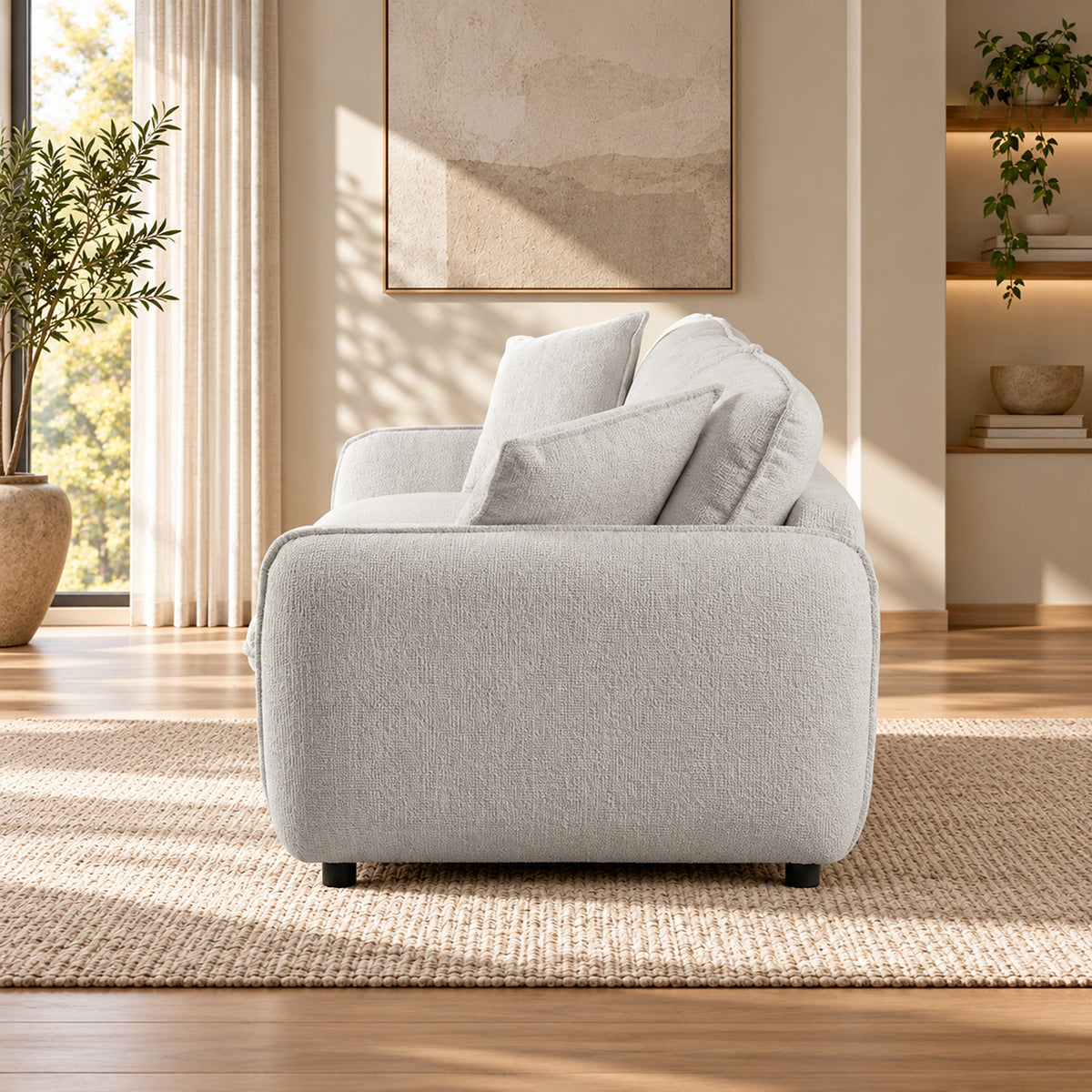 Bradman Snow 3 seater duck feather sofa with curved arms, plush cushions and textured Shay fabric upholstery, side view