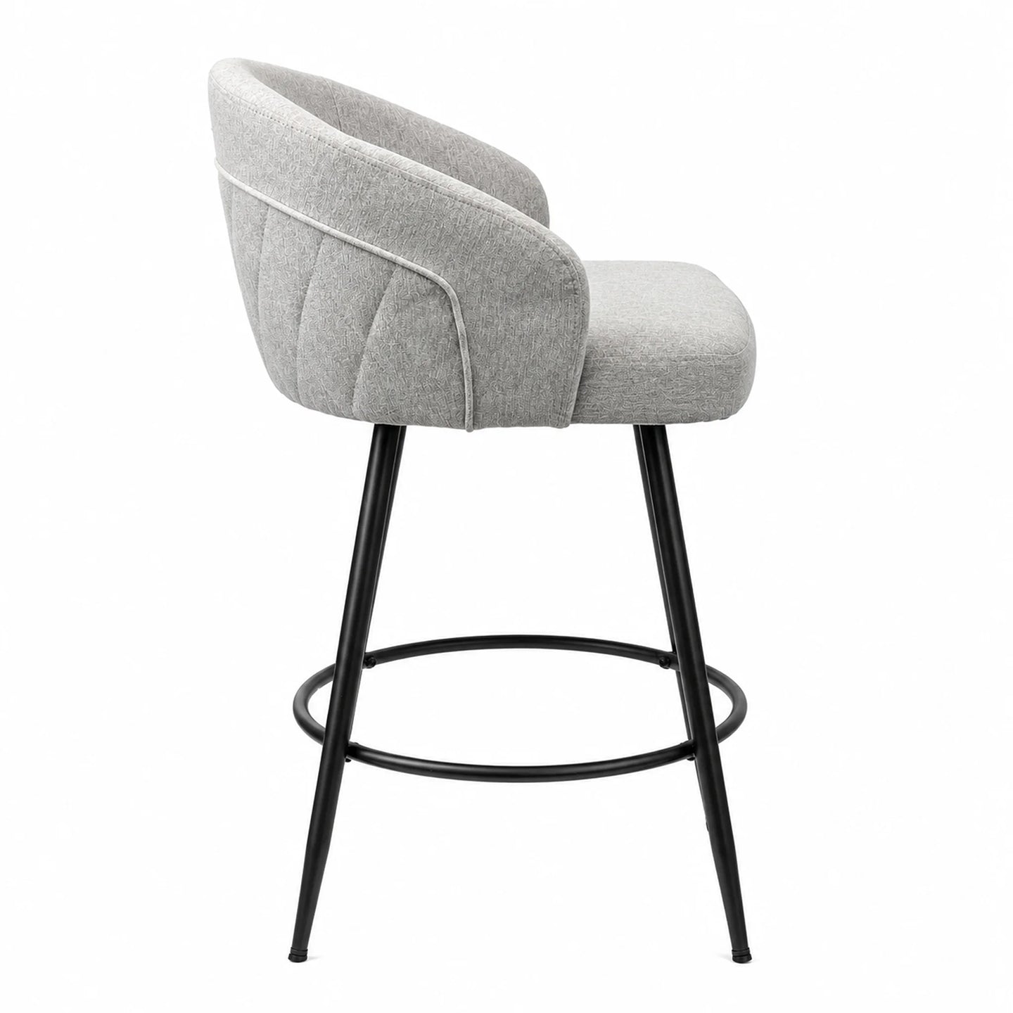 A modern bar stool with a light gray upholstered seat and curved backrest, supported by slim black metal legs and a circular footrest, shown against a plain white background.