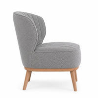 A modern accent chair with a textured gray bouclé fabric upholstery, a curved backrest, and light natural wood legs, shown from a three-quarter angle on a white background.