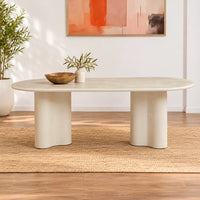 Coastal 2.2m Pebble dining table with matte micro-cement finish, softly rounded tabletop and sculptural curved pedestal bases