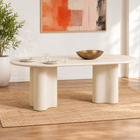 Coastal 2.2m Pebble dining table with matte micro-cement finish, softly rounded tabletop and sculptural curved pedestal bases