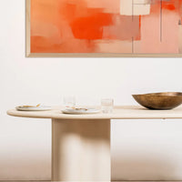 Coastal 2.2m Pebble dining table with matte micro-cement finish, softly rounded tabletop and sculptural curved pedestal bases