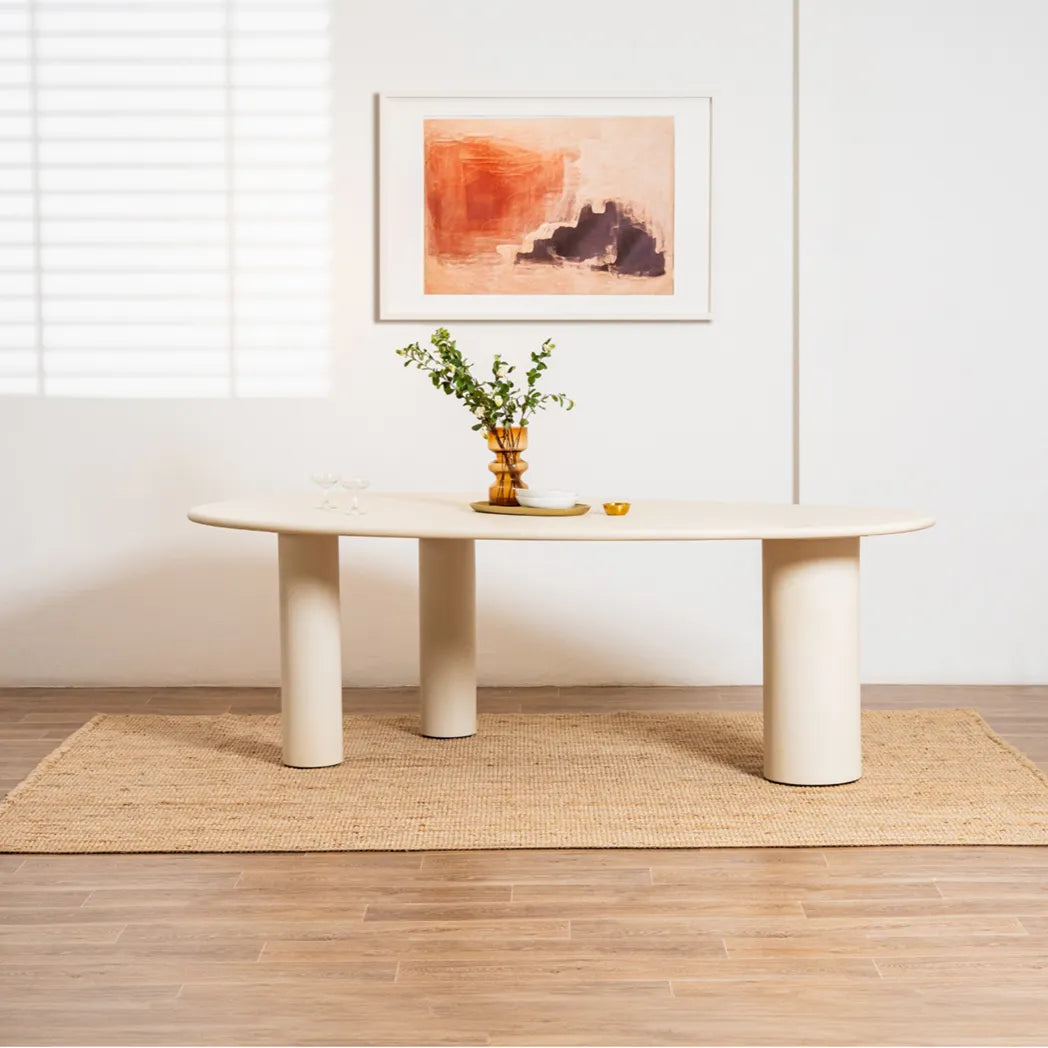 Coastal 2.3m Pebble dining table with matte micro-cement finish, organic asymmetrical tabletop and cylindrical legs