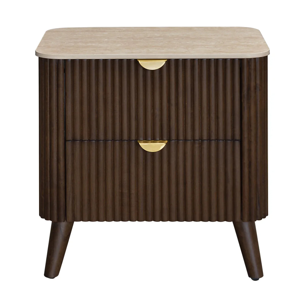 A mid-century modern two-drawer nightstand with a fluted dark brown wood cabinet, a light beige stone top, and gold-finished drawer pulls, shown on a plain white background.