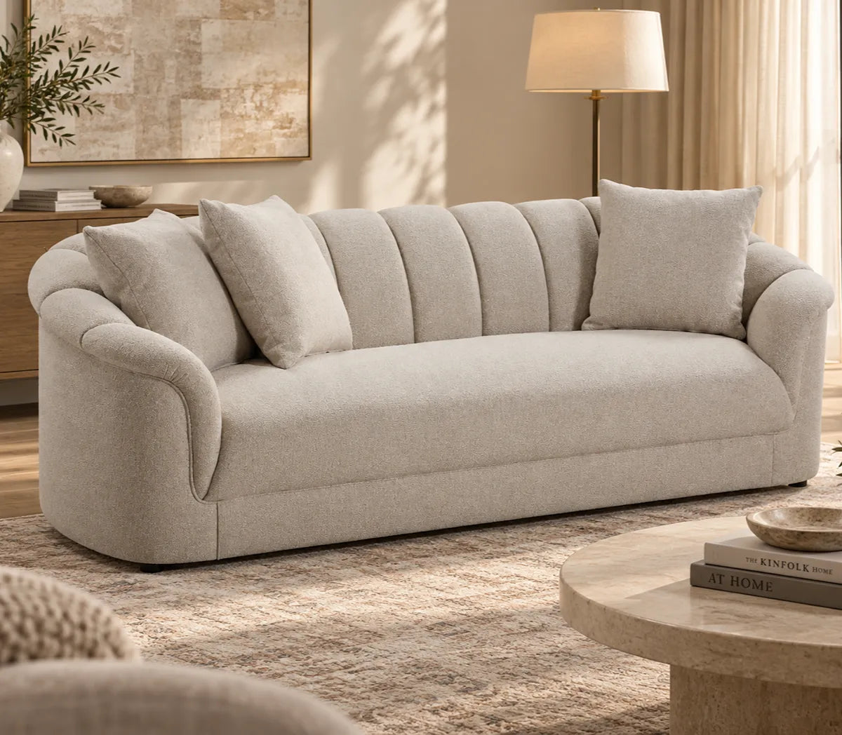 Eastwood beige 3 seater sofa with curved arms, vertical channelled backrest and three scatter cushions, side view