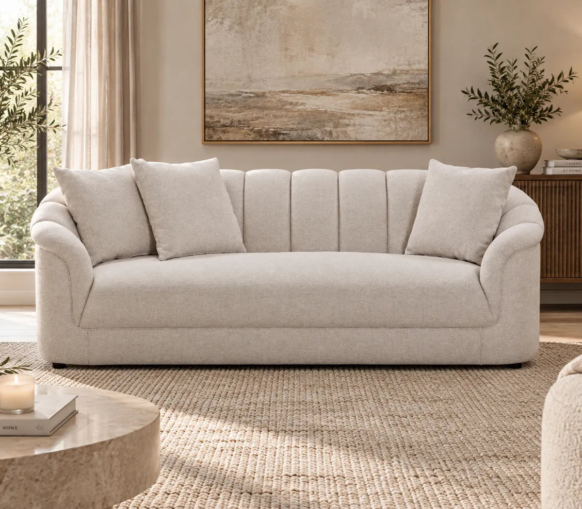 Eastwood beige 3 seater sofa with curved arms, vertical channelled backrest and three scatter cushions, front view