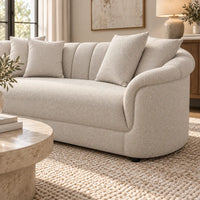 Eastwood beige 4 seater sofa with curved arms, vertical channelled backrest and four scatter cushions, side view