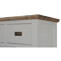 A close-up of a white wooden cabinet or dresser with a rustic brown wood top and a recessed metal drawer pull, shown against a plain white background.
