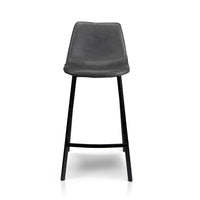 A modern bar stool with a dark gray upholstered seat and a black metal frame, shown against a plain white background.