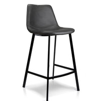 A modern counter stool with a black faux leather seat and a black metal frame with four legs, shown on a white background.