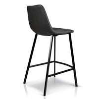 A modern counter stool with a black faux leather seat and a black metal frame, shown from a three-quarters angle on a white background.