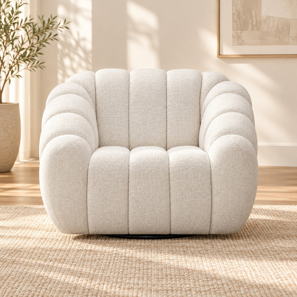 Kenya Beige swivel armchair with curved low-profile design, slanted arms and vertical panel detailing, front view