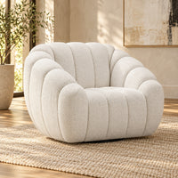 Kenya Beige swivel armchair with curved low-profile design, slanted arms and vertical panel detailing, angled view