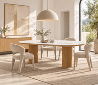 Lucerne natural ceramic dining table with matte white ceramic top and curved white oak veneer legs, angled view
