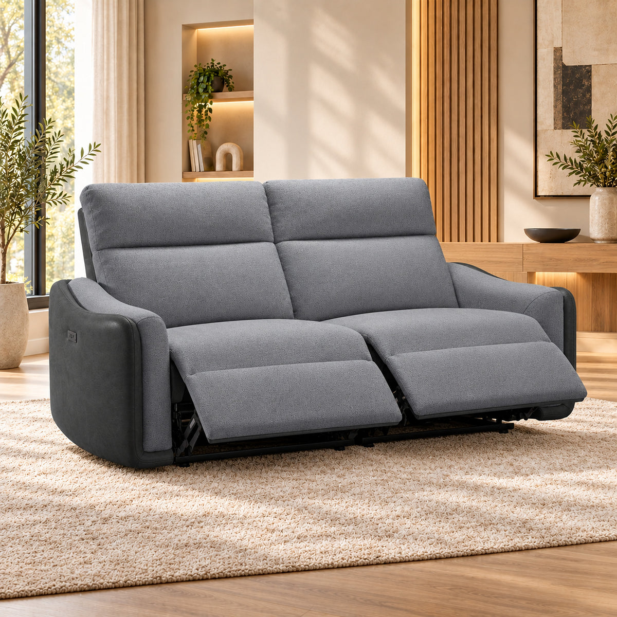 Momba Grey 2 seater electric recliner lounge with two-tone fabric, curved arms and supportive high backrests, angled view