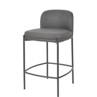 A modern bar stool with a gray upholstered seat and curved backrest, supported by a slim black metal frame with a footrest, shown on a plain white background.