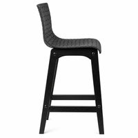 A modern outdoor bar stool with a black woven wicker seat and a solid black wooden frame, shown from a side profile view against a plain white background.