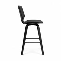 A modern black bar stool with a curved backrest, padded seat, and four tapered legs, shown from a side profile on a white background.