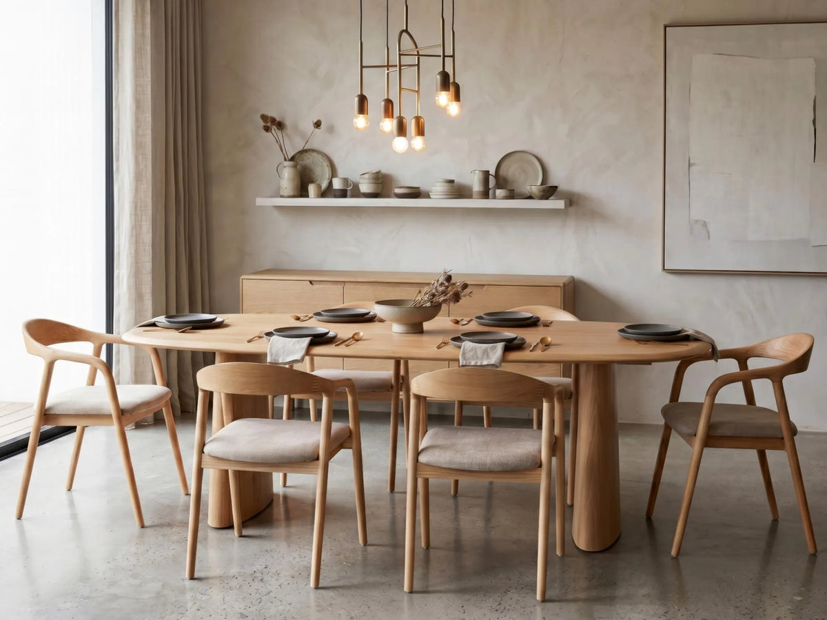 Solaro Natural Oak dining table with ash veneer top and sculptural curved pedestal legs, with bosino chairs