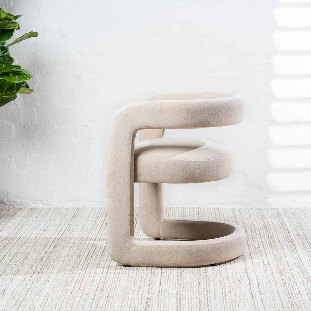 Toronto sand linen dining chair with curved wraparound backrest – side three-quarter view