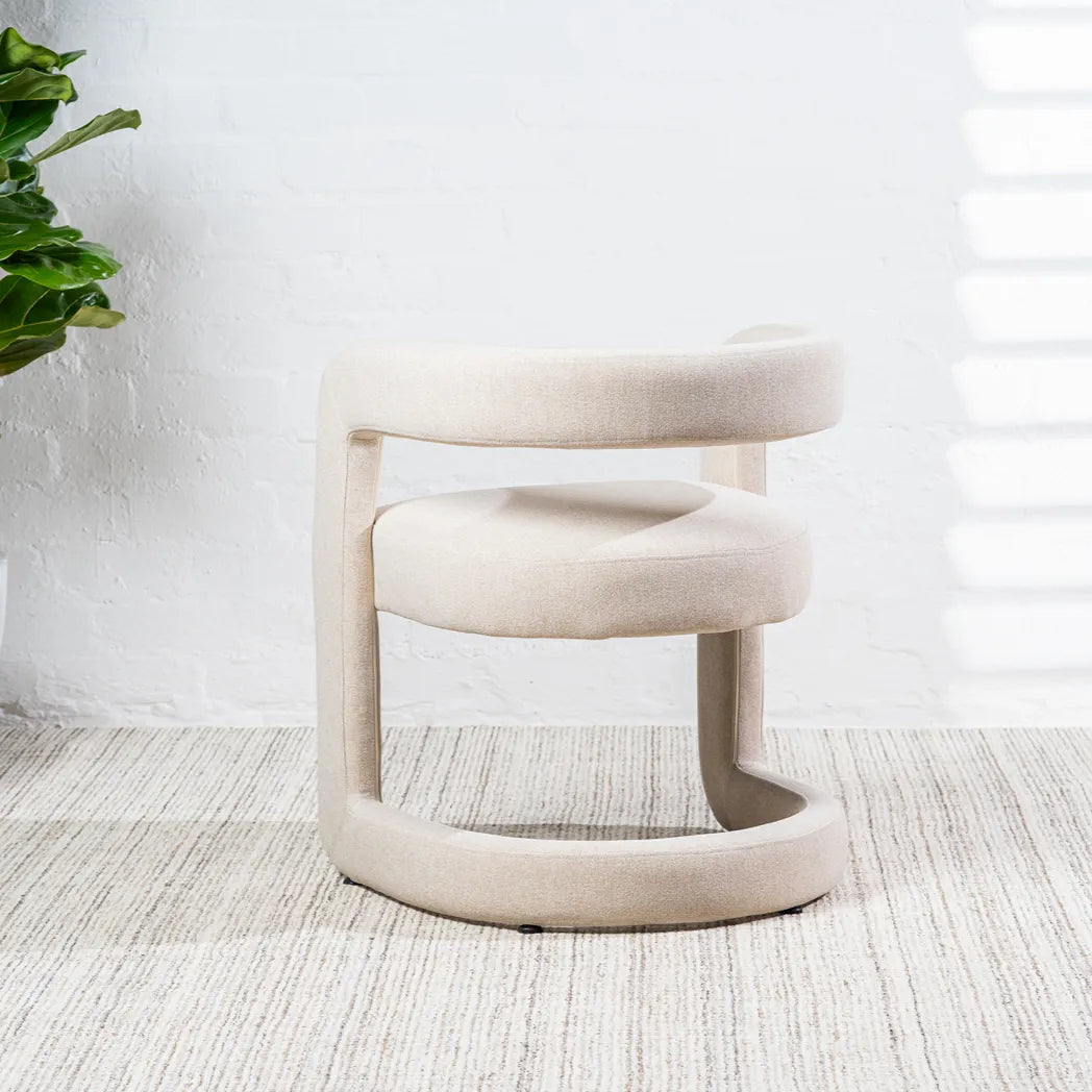 Toronto sand linen dining chair with curved wraparound backrest – back three-quarter view