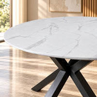 Zorian 1.2m White round dining table with marble-look top and sculptural black powder-coated metal legs, close up view