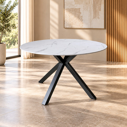 Zorian 1.2m White round dining table with marble-look top and sculptural black powder-coated metal legs, front view