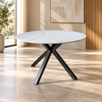 Zorian 1.2m White round dining table with marble-look top and sculptural black powder-coated metal legs, front view